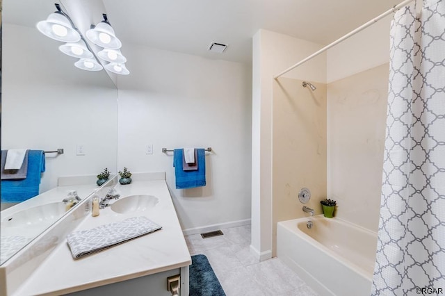 bathroom with vanity, an inviting chandelier, and shower / bath combo with shower curtain