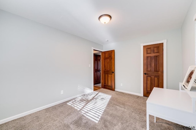 unfurnished office featuring light carpet