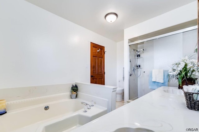 full bathroom with vanity, toilet, and separate shower and tub