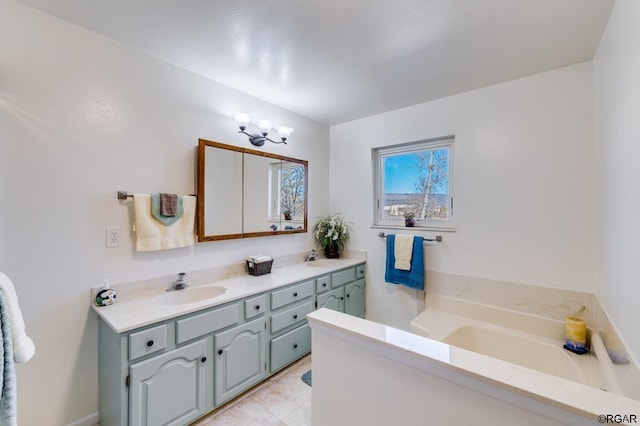 bathroom featuring vanity, tile patterned flooring, and a bathing tub