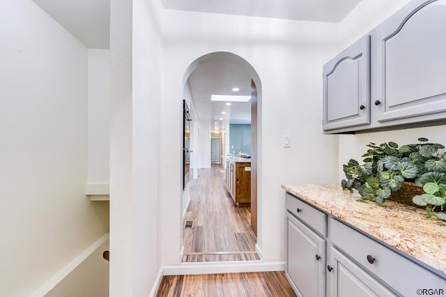 hall with light hardwood / wood-style flooring