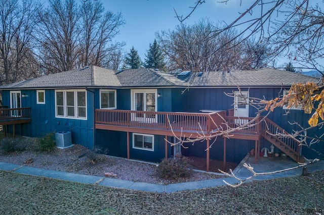 back of house featuring a wooden deck and central AC