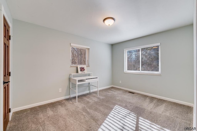 unfurnished room featuring carpet floors