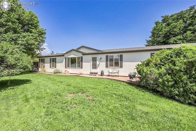 1431 Pine St, Canon City, CO 81212 - view of front of house with a front lawn and stucco siding