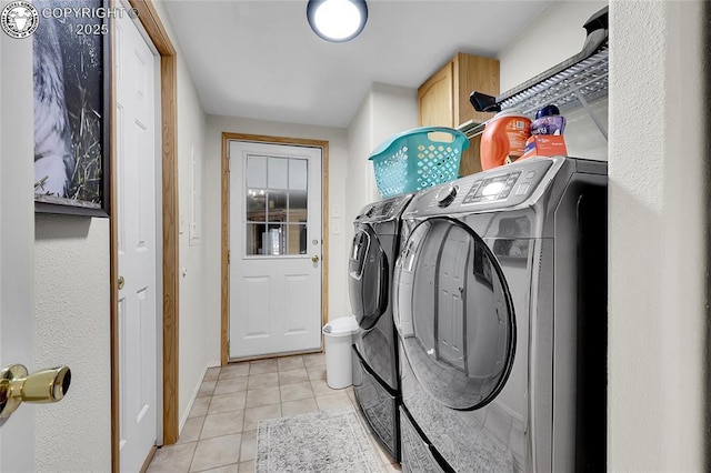 1431 Pine St, Canon City, CO 81212 - laundry room featuring washer and dryer, cabinet space, and light tile patterned floors