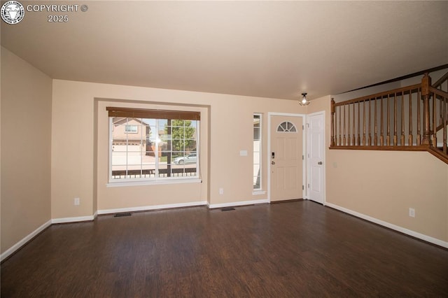7465 Sun Prairie Dr, Colorado Springs, CO 80925 - entrance foyer with dark wood-style flooring and stairs