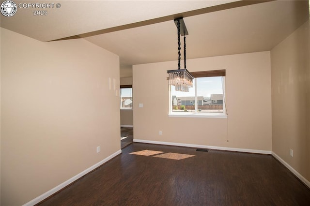 7465 Sun Prairie Dr, Colorado Springs, CO 80925 - empty room with dark wood-style floors and a chandelier