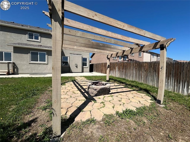 7465 Sun Prairie Dr, Colorado Springs, CO 80925 - fenced backyard with a patio area, a pergola, and a fire pit