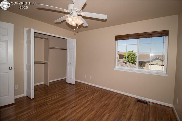 7465 Sun Prairie Dr, Colorado Springs, CO 80925 - unfurnished bedroom featuring wood finished floors, a closet, and a ceiling fan