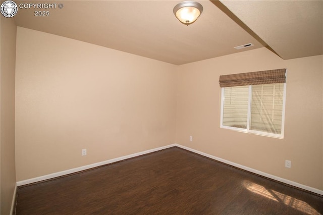7465 Sun Prairie Dr, Colorado Springs, CO 80925 - empty room featuring dark wood-style flooring and baseboards