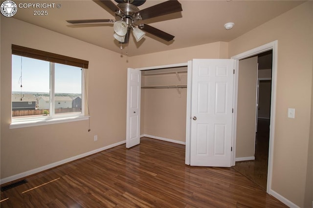 7465 Sun Prairie Dr, Colorado Springs, CO 80925 - unfurnished bedroom with wood finished floors, a closet, and a ceiling fan