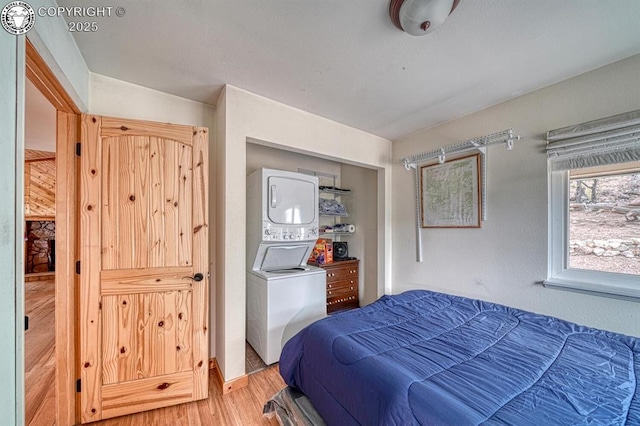 421 Bull Domingo Ln, Westcliffe, CO 81252 - bedroom featuring stacked washer / drying machine and light wood-type flooring
