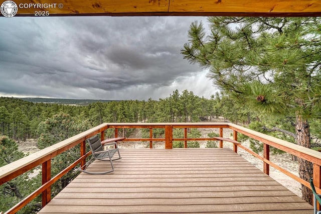 421 Bull Domingo Ln, Westcliffe, CO 81252 - wooden deck featuring a wooded view