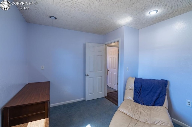 bedroom featuring carpet flooring and baseboards