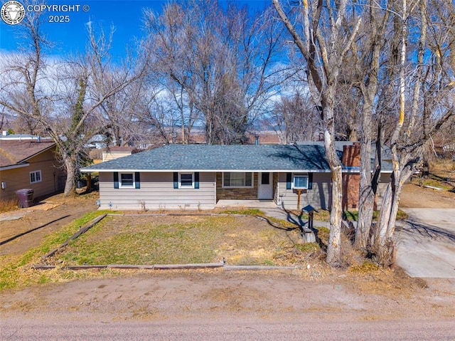 ranch-style house with a front yard