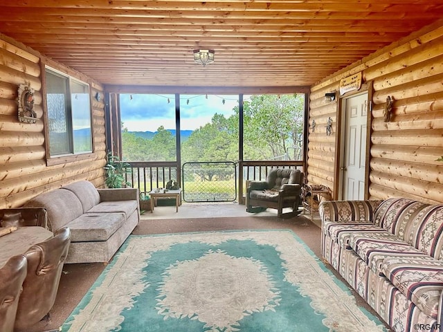 sunroom / solarium featuring wooden ceiling