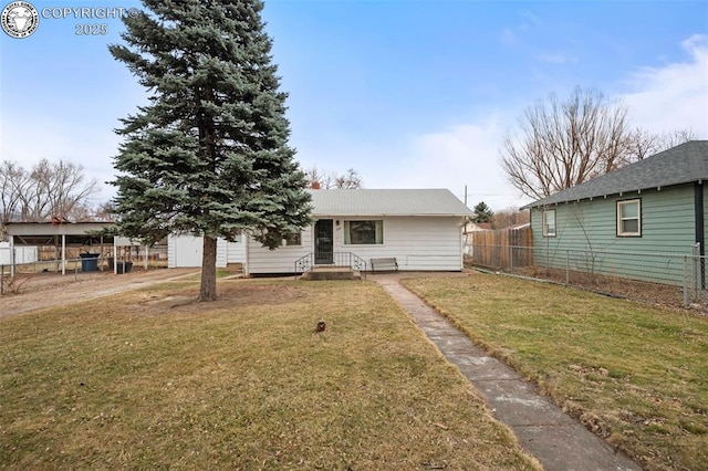 view of front of property with a front yard and fence