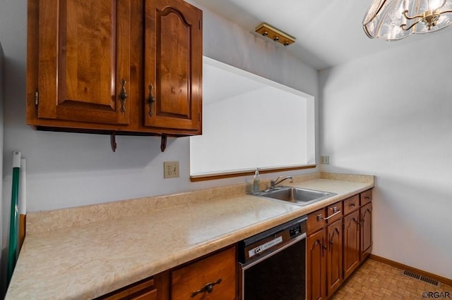 kitchen with sink, a chandelier, and black dishwasher