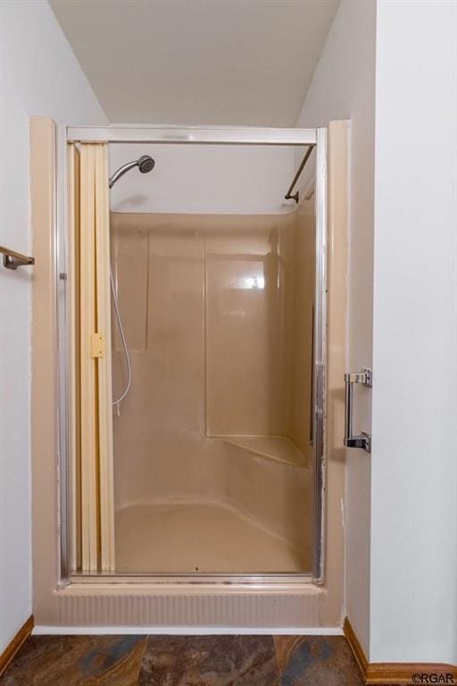 bathroom featuring an enclosed shower