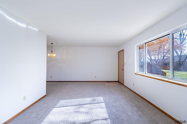 carpeted empty room featuring a healthy amount of sunlight