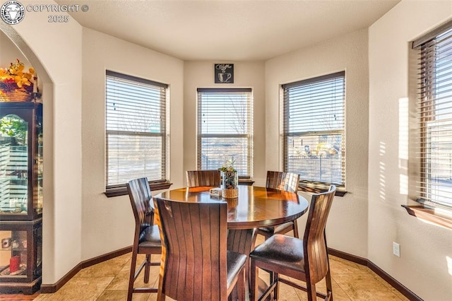 dining area with light tile patterned floors