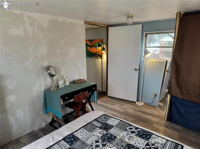 bedroom with hardwood / wood-style floors