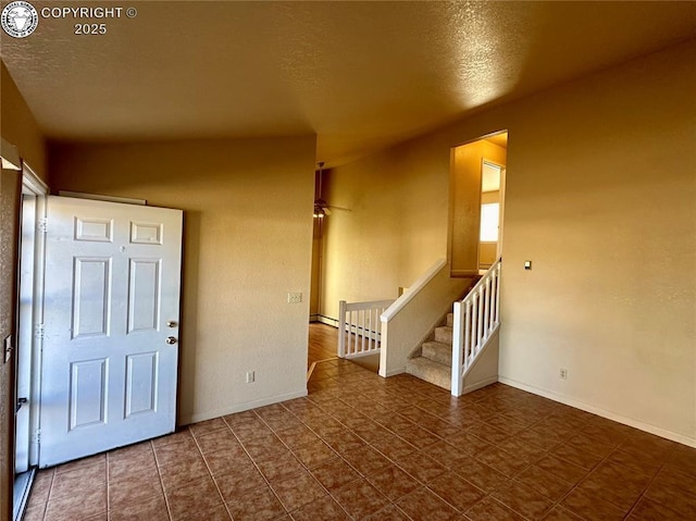 entryway featuring a textured ceiling