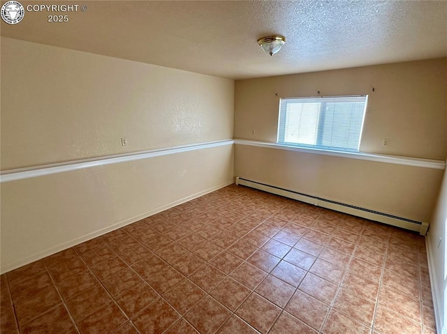 empty room featuring a textured ceiling and baseboard heating