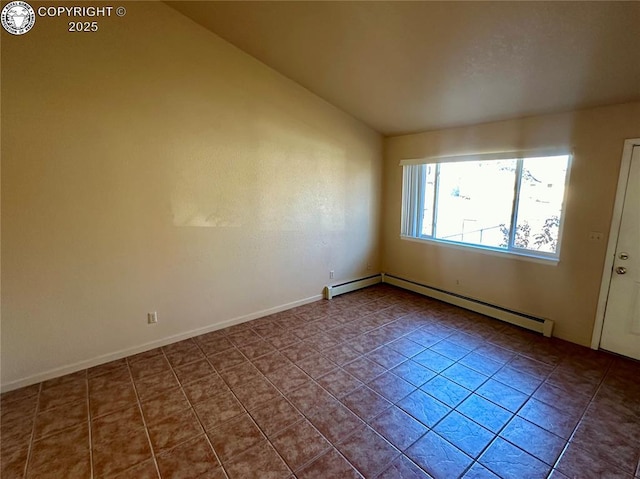 empty room with tile patterned flooring, lofted ceiling, and a baseboard heating unit