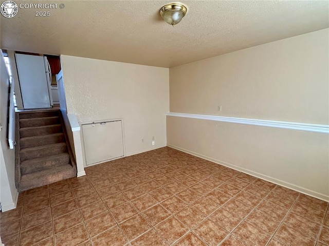 basement with a textured ceiling