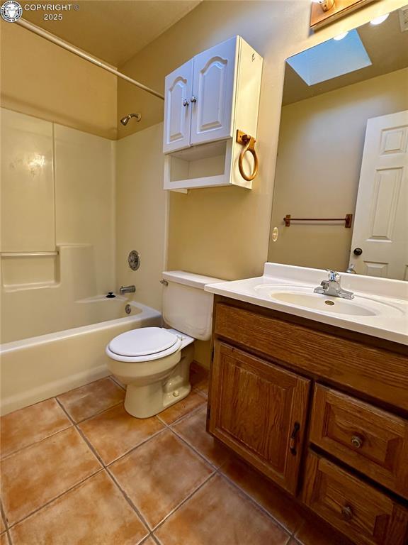 full bathroom featuring vanity, toilet, shower / bath combination, and tile patterned flooring