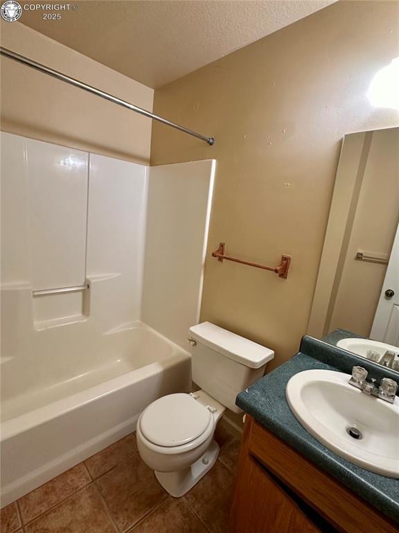 full bathroom featuring tile patterned floors, toilet, a textured ceiling, vanity, and shower / bath combination