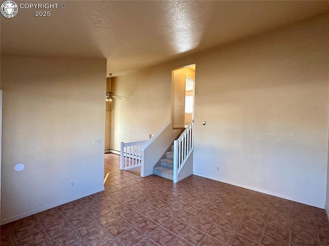 spare room with ceiling fan