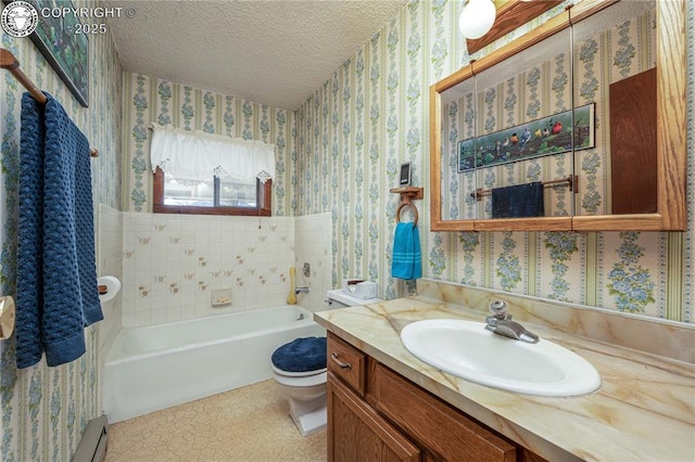 bathroom with vanity, toilet, a textured ceiling, and a tub