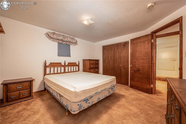 carpeted bedroom featuring a textured ceiling