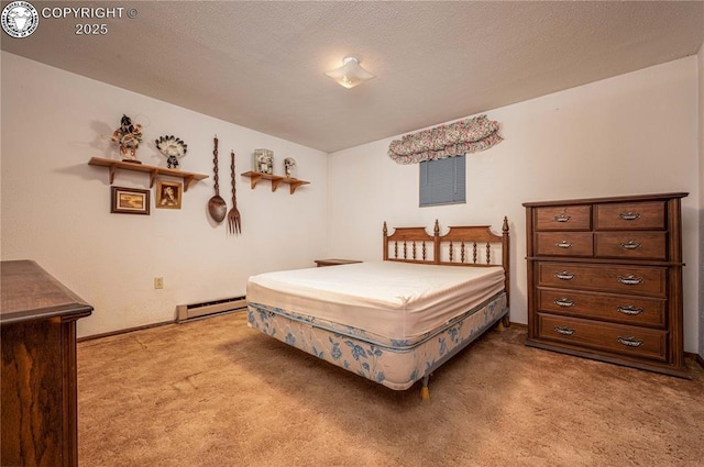 carpeted bedroom featuring a baseboard heating unit and a textured ceiling