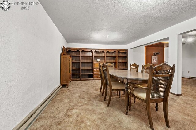 carpeted dining space with a baseboard heating unit and a textured ceiling