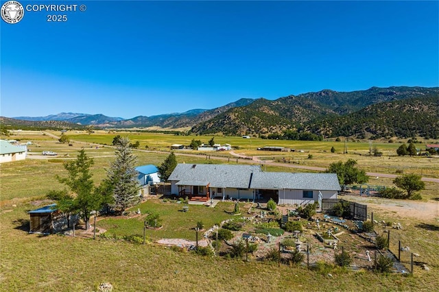 drone / aerial view with a mountain view and a rural view