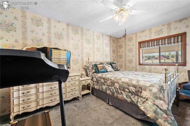 bedroom featuring carpet, a textured ceiling, and ceiling fan