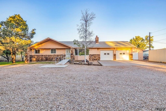 ranch-style home featuring a garage