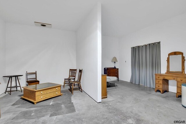 living area featuring concrete floors