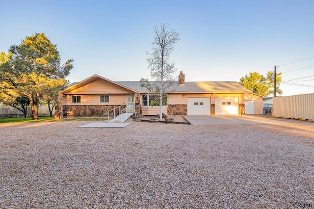 single story home with a garage