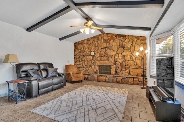 living room with ceiling fan, a fireplace, and vaulted ceiling with beams