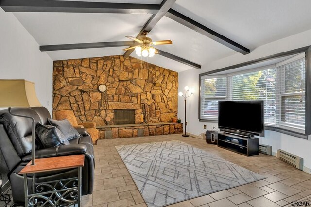 living room featuring ceiling fan, a fireplace, lofted ceiling with beams, and a baseboard heating unit