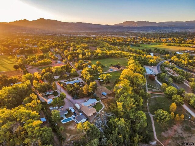 aerial view at dusk featuring a mountain view