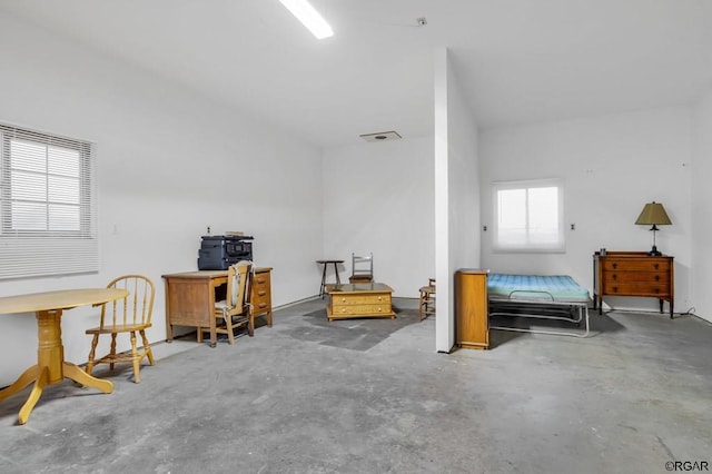 bedroom with concrete flooring