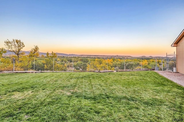 yard at dusk with a mountain view