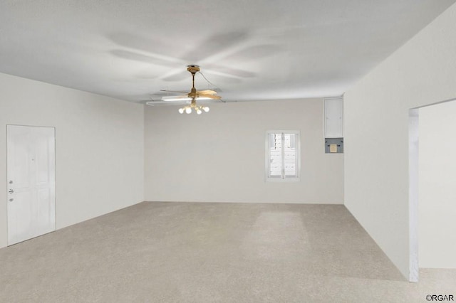 carpeted empty room featuring ceiling fan