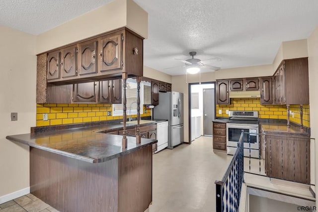 kitchen with ceiling fan, appliances with stainless steel finishes, a textured ceiling, decorative backsplash, and kitchen peninsula