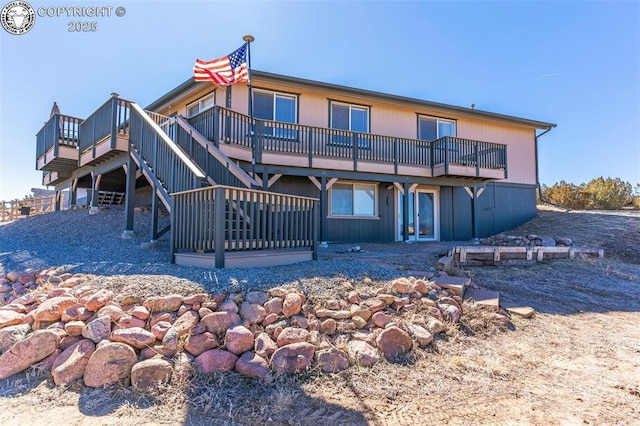 back of house featuring a wooden deck